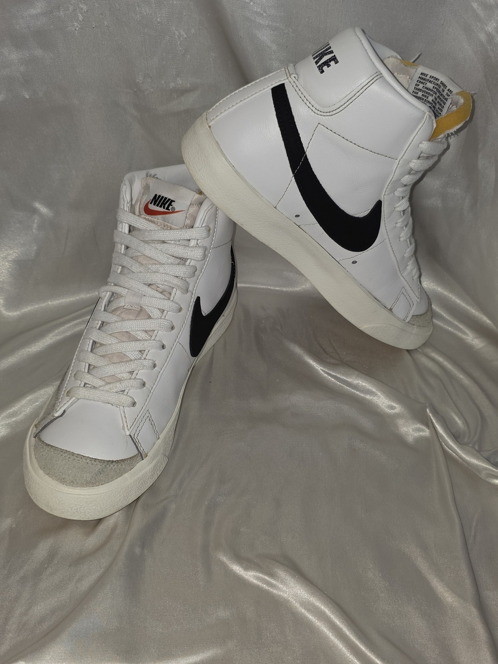 Nike Women’s White High-Top Sneakers with Black Swoosh